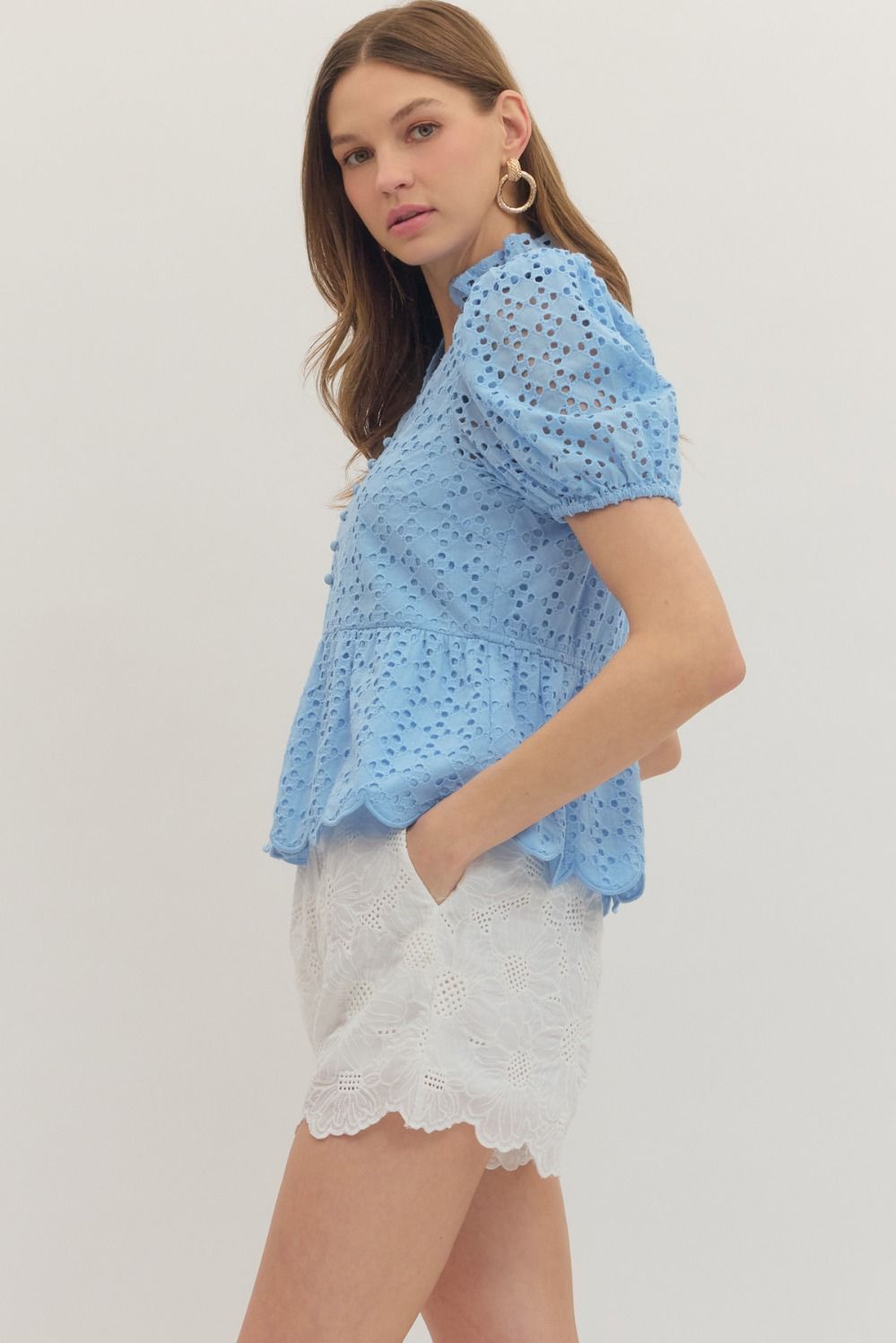 cotton top with puff sleeves, eyelet embroidery, ruffled V-neck, and scallop-trimmed hem