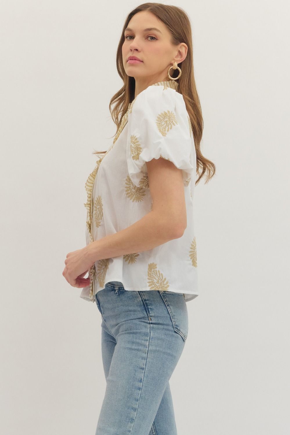 cotton top with botanical embroidery, puff sleeves, and ruffle-trim placket detail