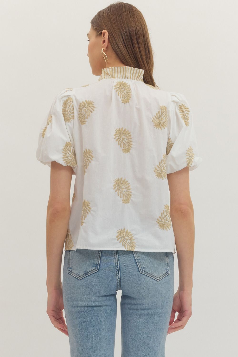 cotton top with botanical embroidery, puff sleeves, and ruffle-trim placket detail