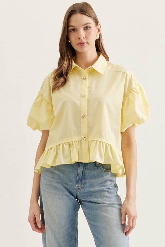  Ruffle Hem Puff Sleeve Top features soft volume sleeves and a feminine ruffle hem 
