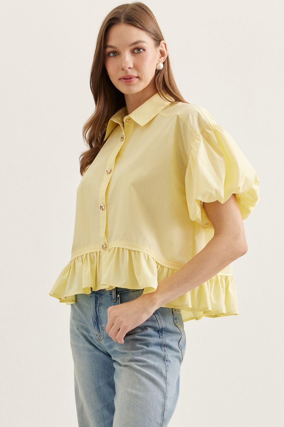  Ruffle Hem Puff Sleeve Top features soft volume sleeves and a feminine ruffle hem 