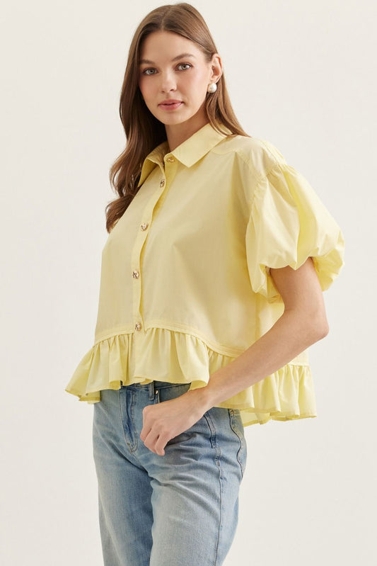  Ruffle Hem Puff Sleeve Top features soft volume sleeves and a feminine ruffle hem 