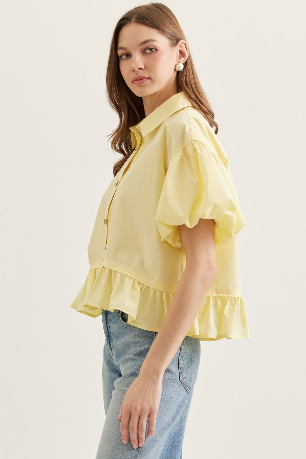  Ruffle Hem Puff Sleeve Top features soft volume sleeves and a feminine ruffle hem 
