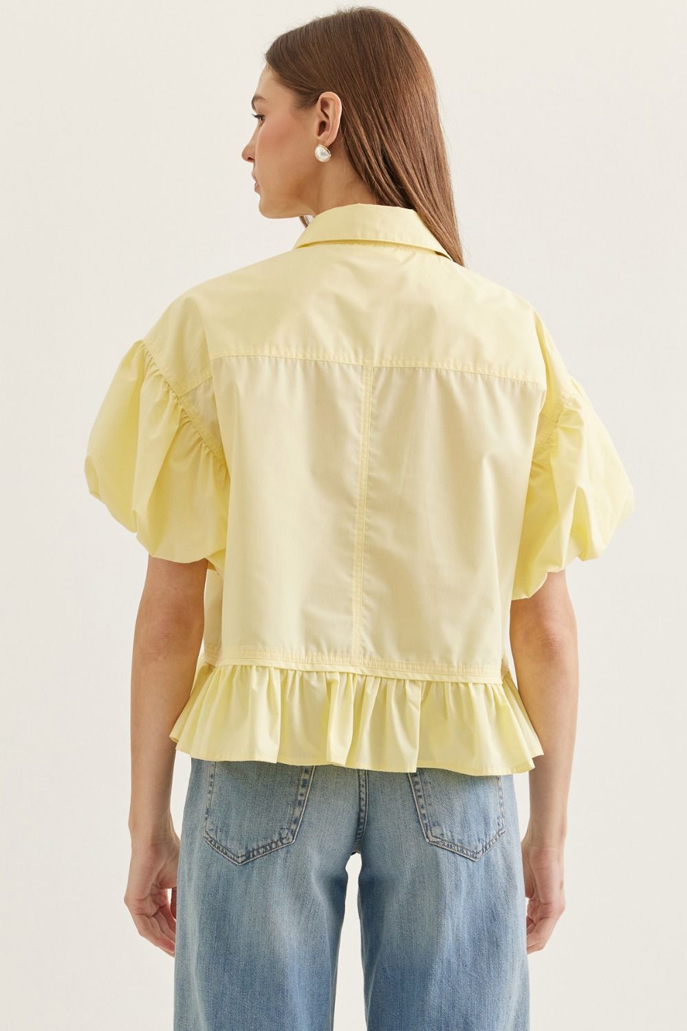 Ruffle Hem Puff Sleeve Top features soft volume sleeves and a feminine ruffle hem 