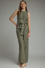A timeless polka dot sleeveless top featuring a flattering tie waist and contrast trim for an effortlessly polished look. shown with  matching pant
