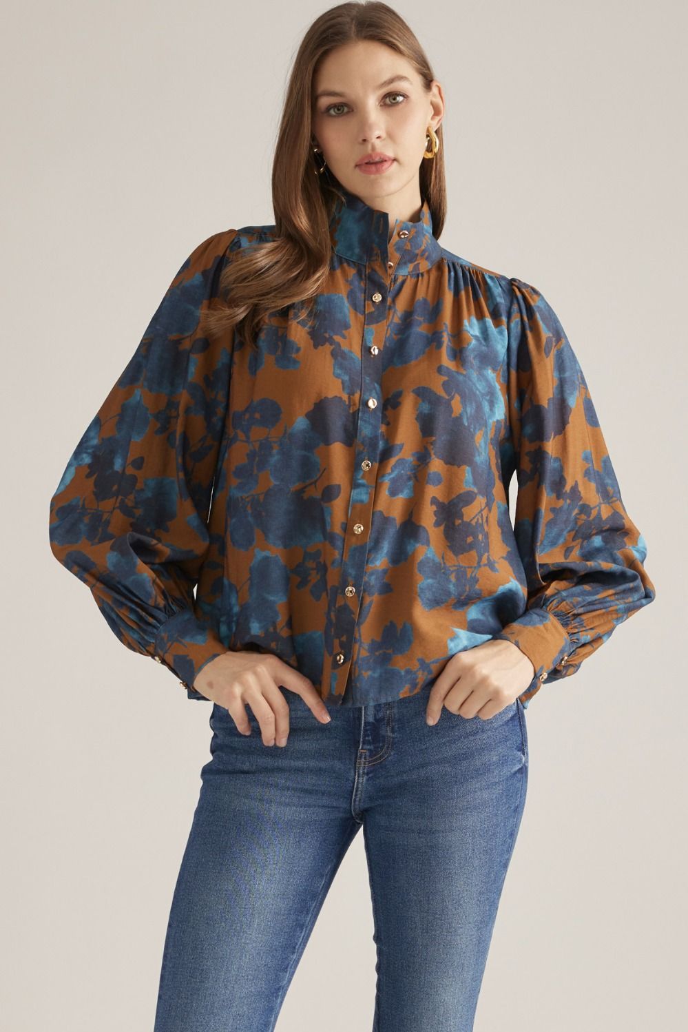 Women's floral woven blouse with stand collar, long puff sleeves, button-front closure, and gathered back yoke