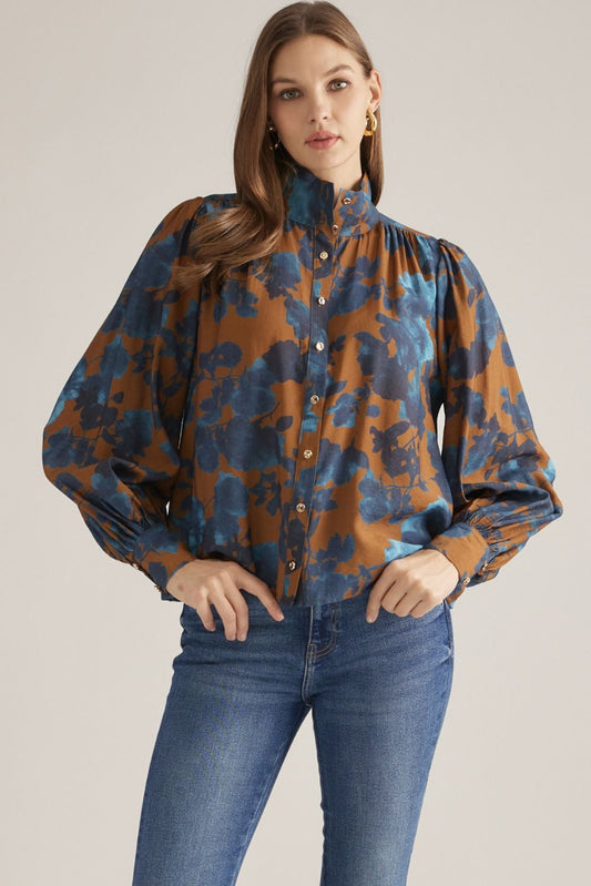 Women's floral woven blouse with stand collar, long puff sleeves, button-front closure, and gathered back yoke