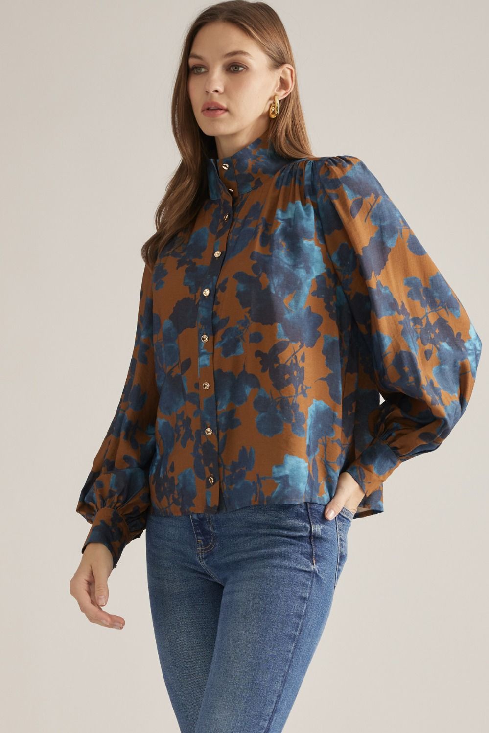 Women's floral woven blouse with stand collar, long puff sleeves, button-front closure, and gathered back yoke