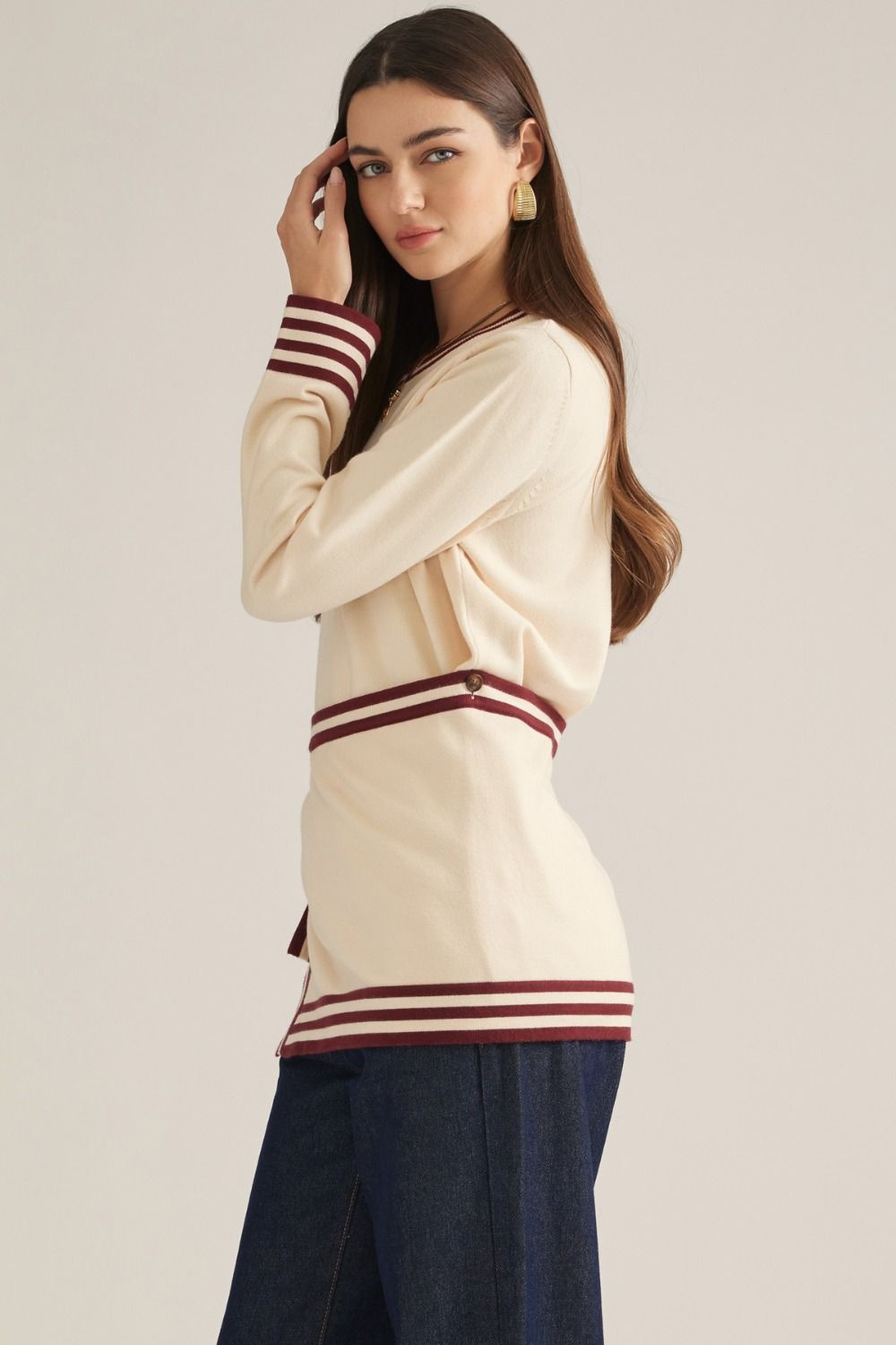 Solid long sleeve knit sweater top with contrast stripe trim and detachable wrap-style waist panel with self-tie detail