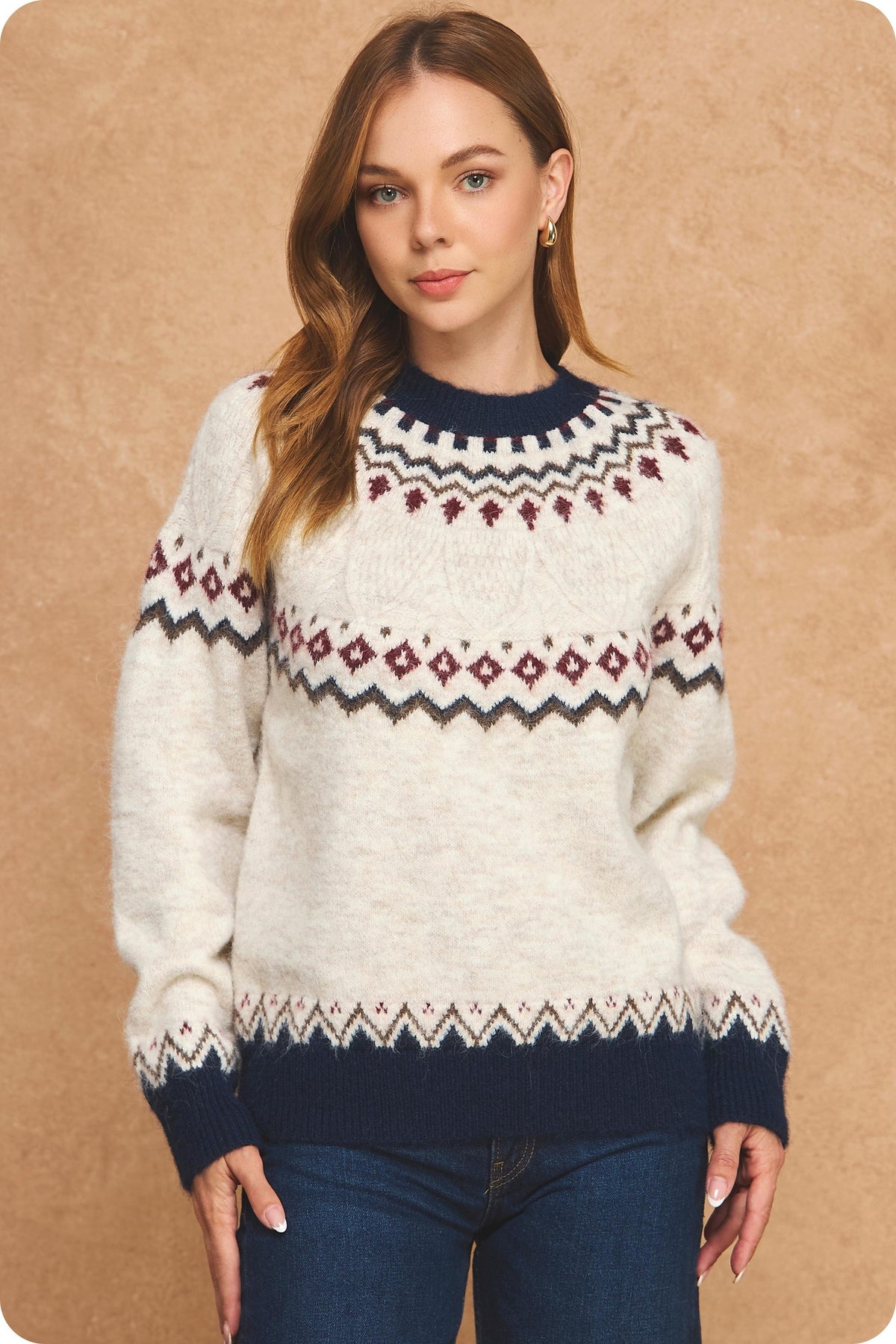 Stay cozy in vintage-inspired style with a soft Fair Isle sweater featuring a cream knit base, rich seasonal colors, and contrasting navy ribbed trim.


