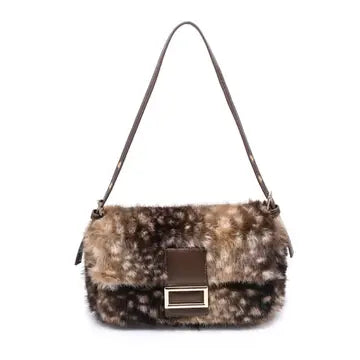 A luxe-looking faux fur crossbody bag featuring a polished rectangular buckle, adjustable strap, and practical interior storage for effortless day-to-night style.