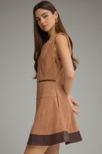 A chic faux suede mini dress featuring a flattering belted waist, faux leather hem, V-neckline, and convenient side pockets.

