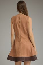 A chic faux suede mini dress featuring a flattering belted waist, faux leather hem, V-neckline, and convenient side pockets.

