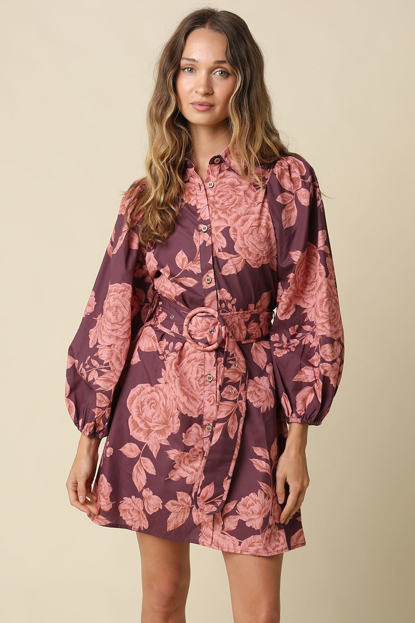The Estelle Floral Belted Mini Dress combines a romantic floral print, voluminous puff sleeves, and a defined belted waist for effortlessly feminine style.