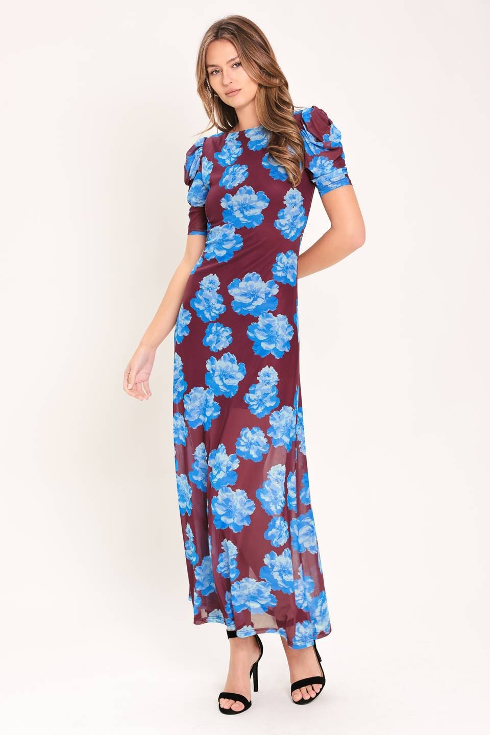 Grace every occasion in this printed power mesh midi dress, featuring elegant puff sleeves, a flattering silhouette, and lightweight comfort you'll love all season.
