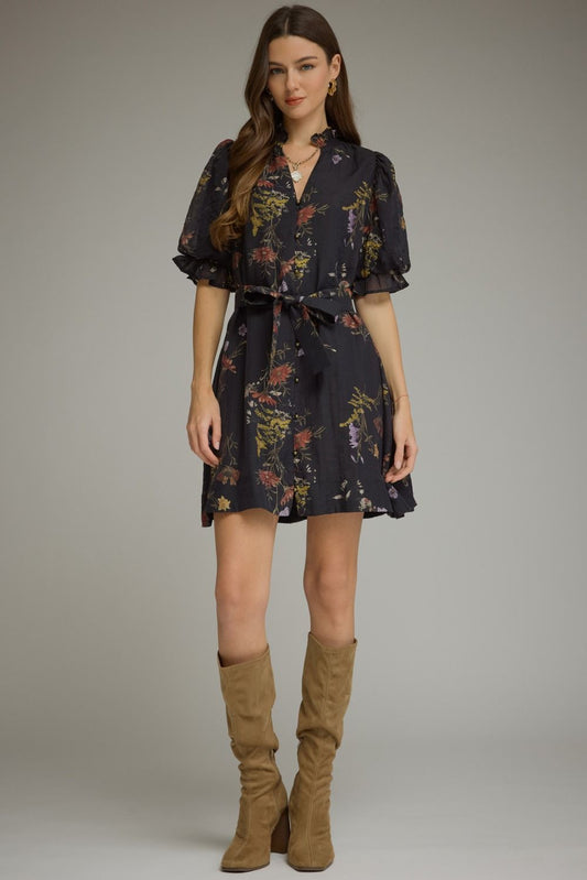 A romantic floral mini dress featuring puff sleeves, a self-tie waist belt, and a ruffled V-neckline for effortlessly feminine style.
