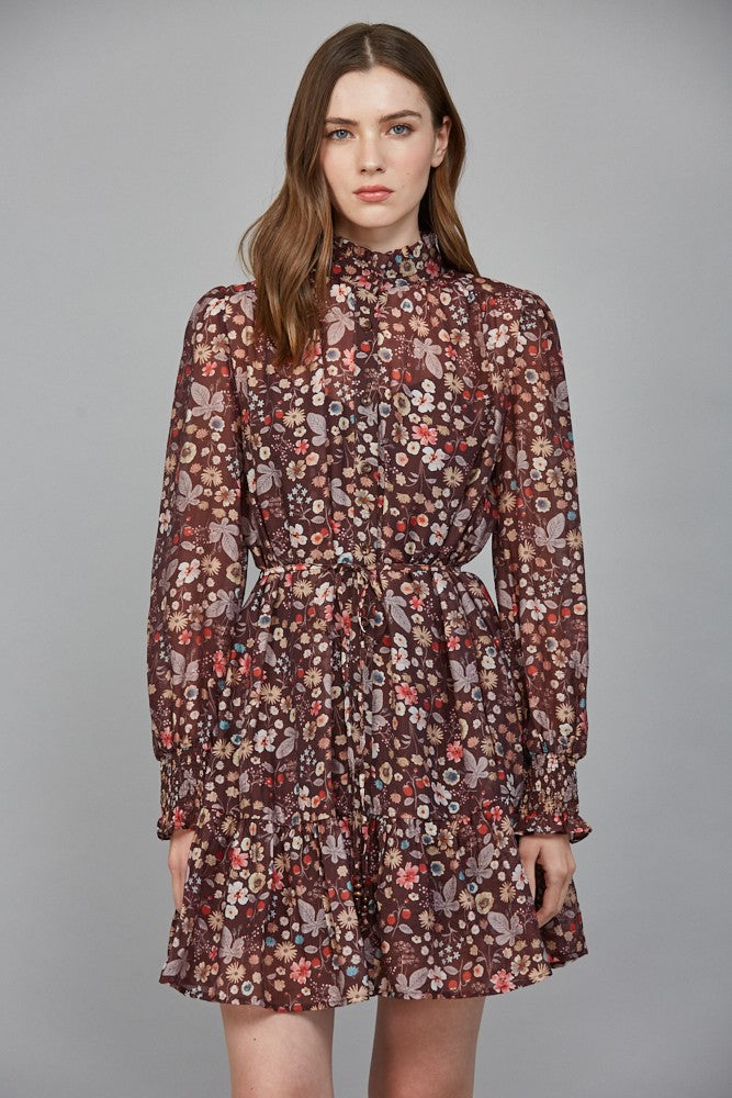 A romantic floral print dress featuring a ruffled high neckline, flattering tie waist, and flowing silhouette for effortlessly elegant style.