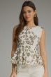 A feminine floral peplum top featuring a flattering sleeveless silhouette, classic round neckline, and lightweight woven fabric for effortless everyday style.