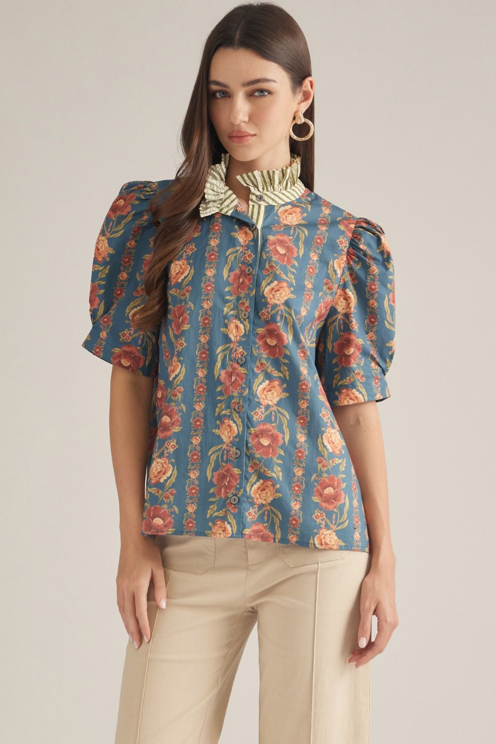 The Edith Floral Ruffle Neck Top brings feminine charm to everyday dressing with a delicate floral print, puff sleeves, and pretty contrast stripe detailing.