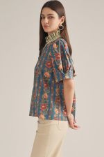 The Edith Floral Ruffle Neck Top brings feminine charm to everyday dressing with a delicate floral print, puff sleeves, and pretty contrast stripe detailing.