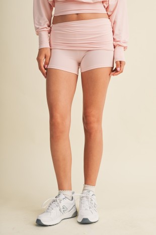 Chic and comfortable mini shorts featuring a flattering foldover waistband and soft knit fabric for an effortlessly stylish everyday look.