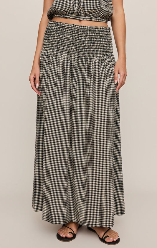 A breezy plaid linen-blend maxi skirt featuring a flattering smocked waistband and flowing silhouette for effortless, everyday elegance.
