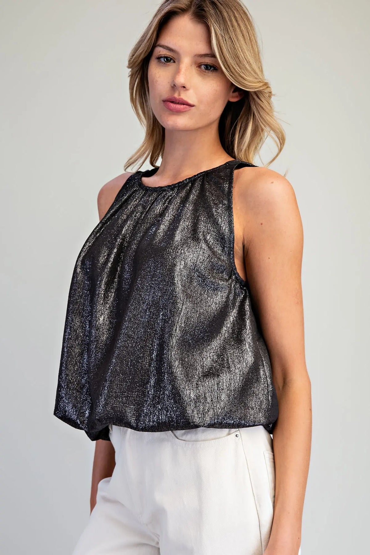Add a touch of modern elegance to any outfit with this shimmery bubble hem tank top featuring a gathered neckline and sophisticated back keyhole detail.