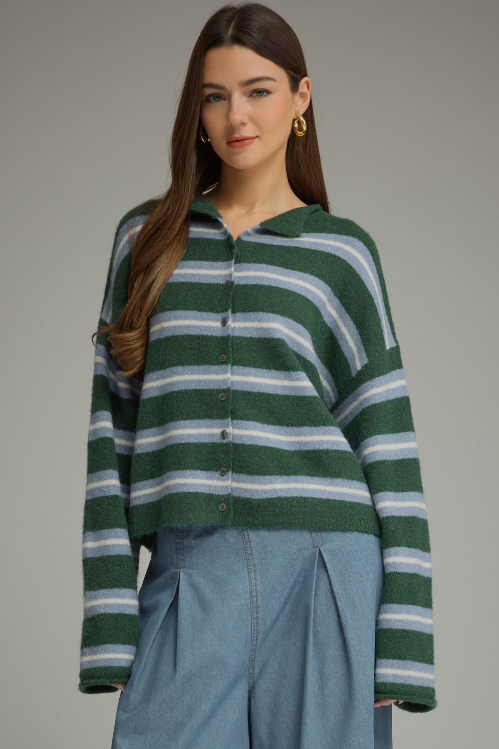 A cozy-chic striped cardigan featuring a classic shirt collar, button-front closure, and soft fuzzy texture for an effortlessly elevated seasonal layer.