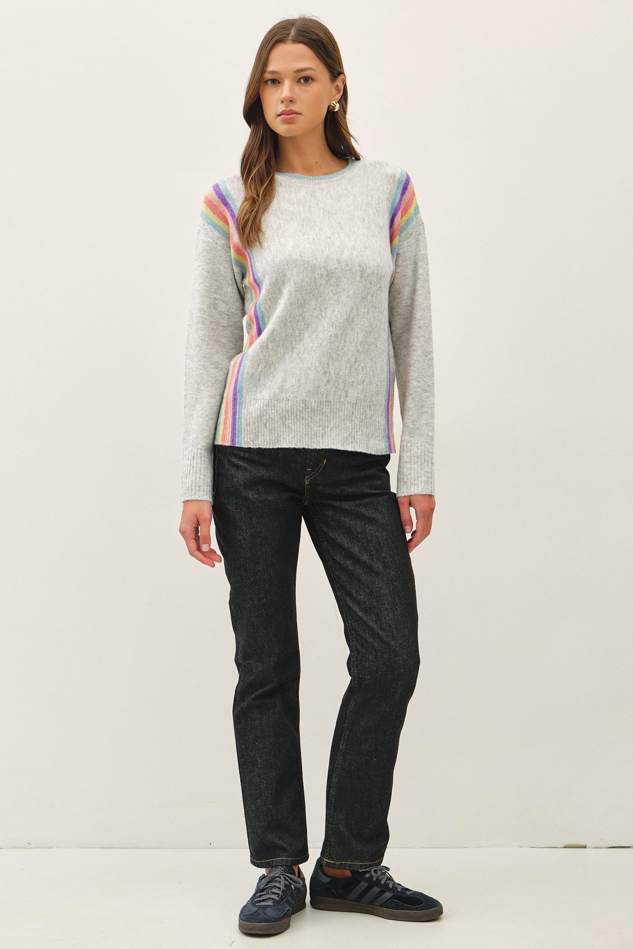 lightweight striped wool blend sweater featuring a soft hand feel, relaxed fit, and vertical rainbow design.