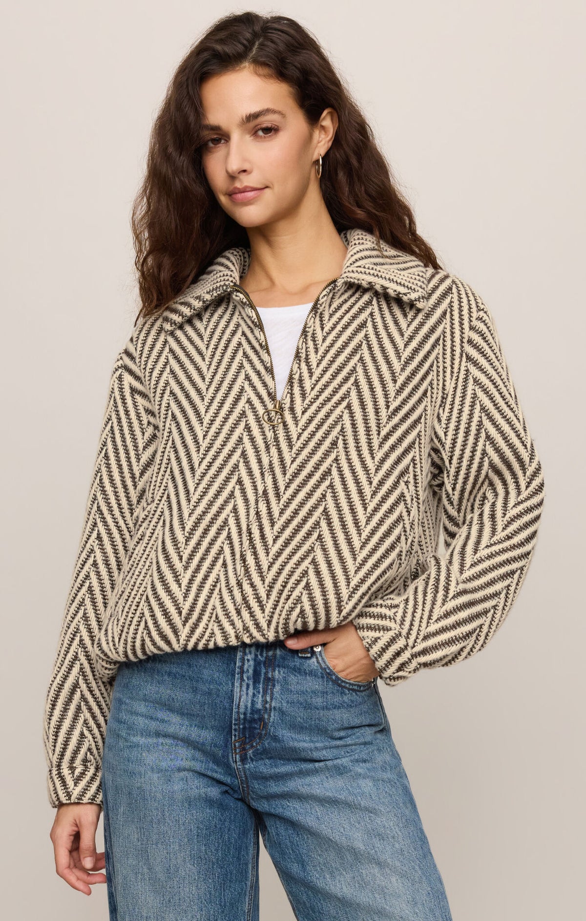 A polished herringbone jacket featuring a classic collar, long sleeves, zip-front closure, and welt pockets for timeless everyday style.