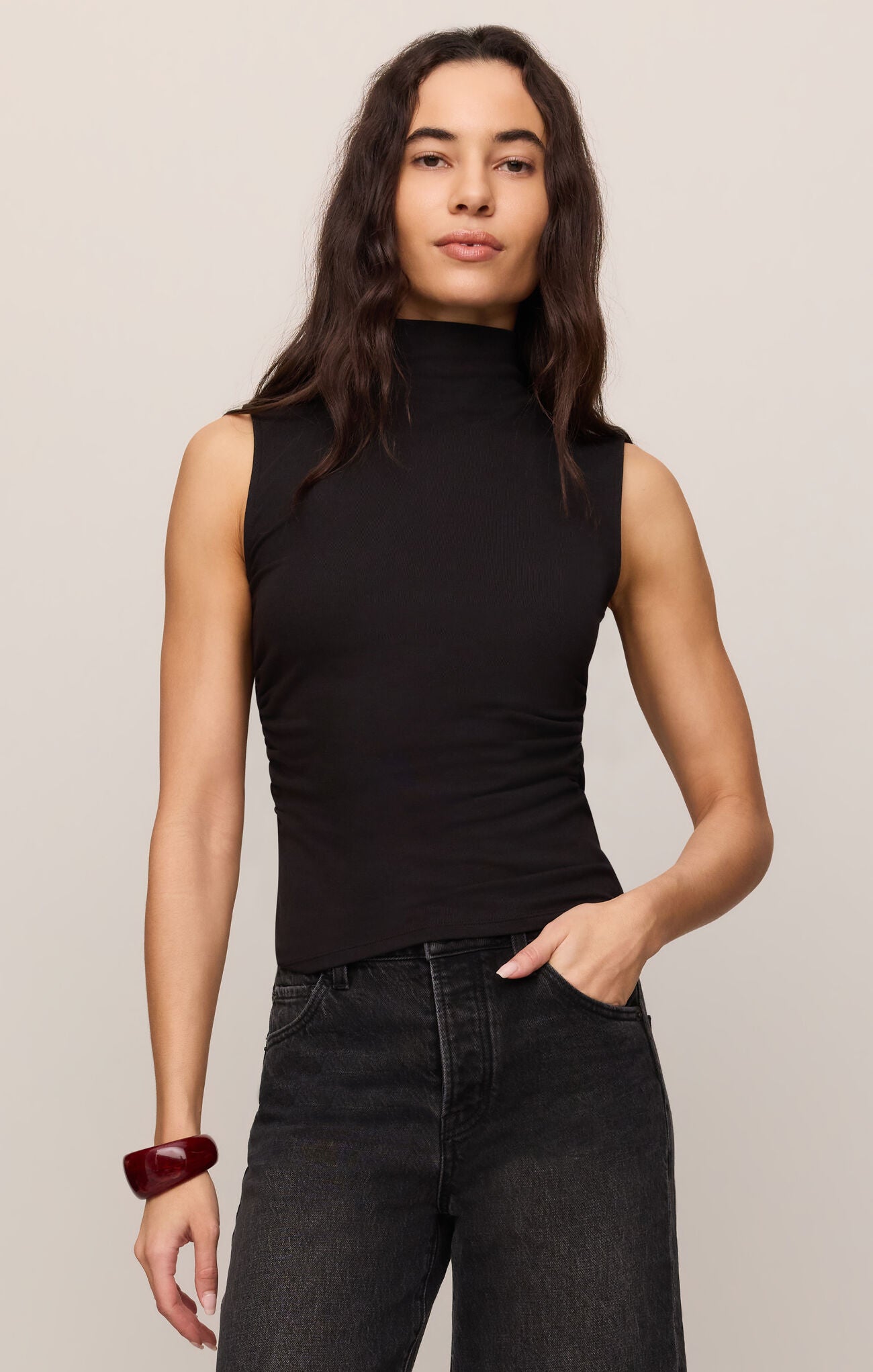 A sleek sleeveless turleneck crafted from ultra-soft second skin baby rib fabric for a smooth, flattering fit you'll wear year-round.

