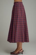 A timeless plaid midi skirt featuring flattering gathered detail, a comfortable elastic-back waist, and practical side pockets.
