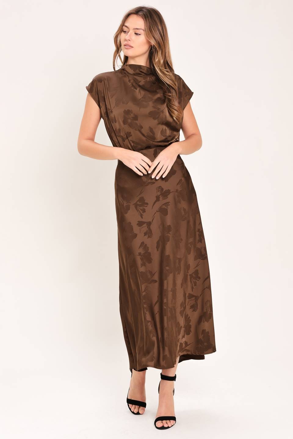 Chic woven jacquard top featuring a sophisticated funnel neckline, short sleeves, and a polished back zipper closure.
