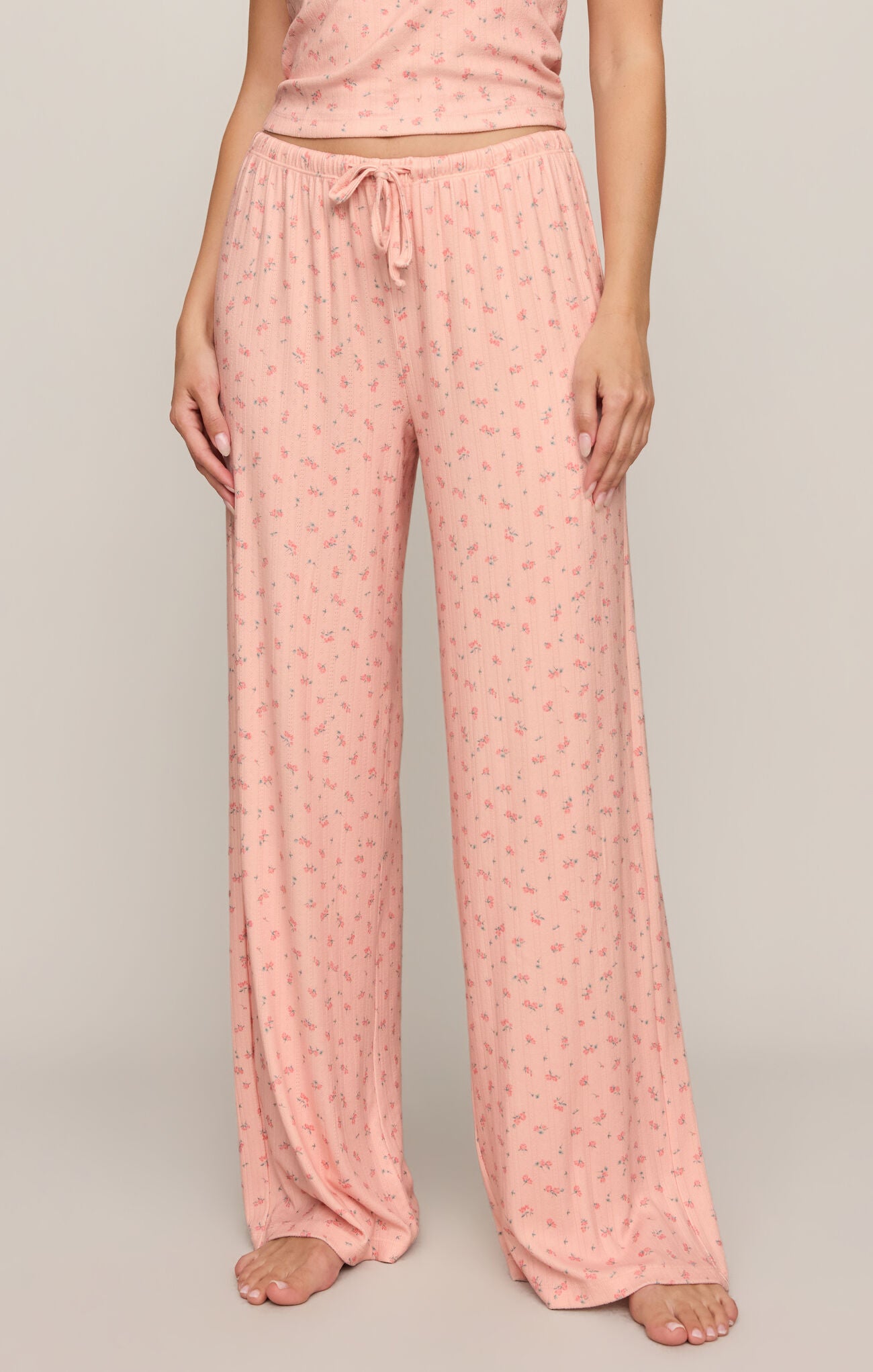 Elegant comfort meets effortless style in these high-rise silky pointelle floral pants featuring a soft stretch feel and relaxed, flattering fit.
