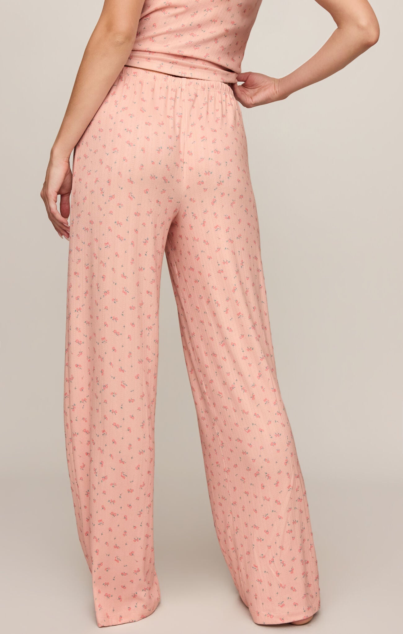 Elegant comfort meets effortless style in these high-rise silky pointelle floral pants featuring a soft stretch feel and relaxed, flattering fit.

