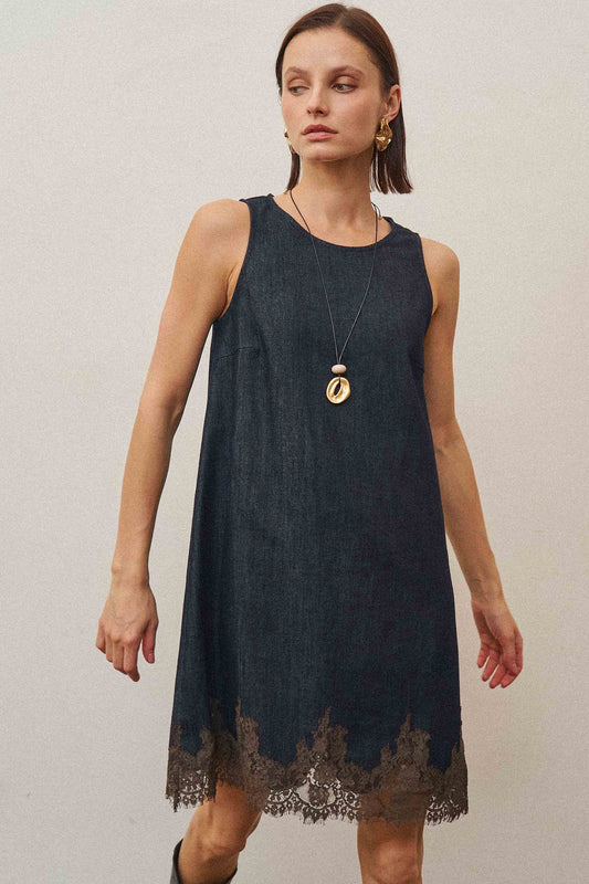 A feminine denim shift dress featuring delicate lace trim, a flattering sleeveless silhouette, and soft stretch denim for effortless all-day style.