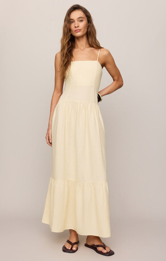 A breezy linen-blend maxi dress featuring a flattering square neckline, adjustable spaghetti straps, and an effortlessly elegant silhouette made for sunny days.