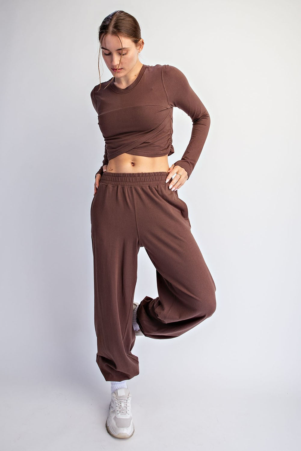 A soft, breathable cotton Lycra two-piece set featuring a cropped long sleeve top and relaxed ankle-length pants for effortless comfort from active days to downtime.

