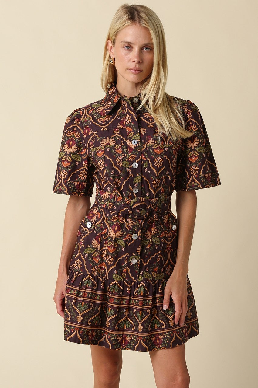 A romantic cotton paisley mini dress featuring a flattering fit-and-flare silhouette, puff sleeves, removable self-tie belt, and tiered ruffle hem.

