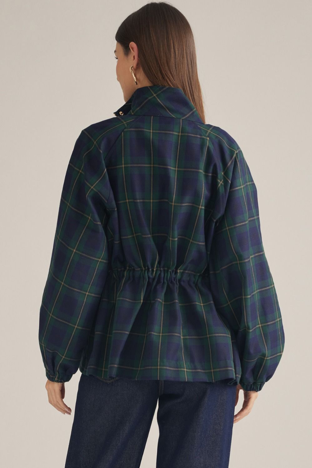 A lightweight plaid jacket featuring a high neckline, adjustable drawstring waist, and zip-front design for effortless seasonal layering.