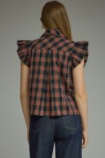 The Della Plaid Ruffle Sleeve Top combines classic plaid with feminine ruffle trim, a button-front placket, and polished collar detail.