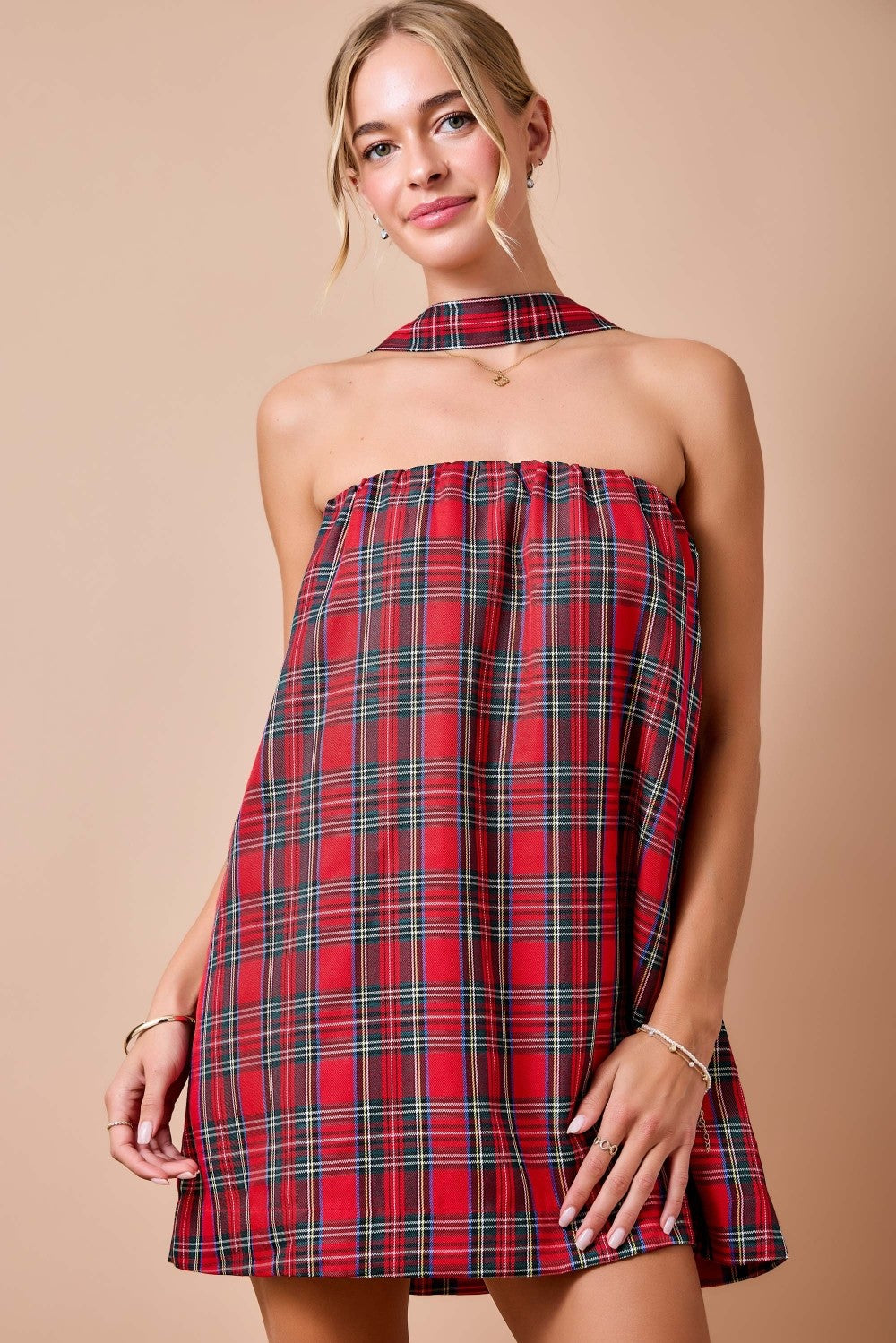 Celebrate the season in style with this festive holiday plaid strapless mini dress, complete with a matching scarf for a coordinated holiday look.