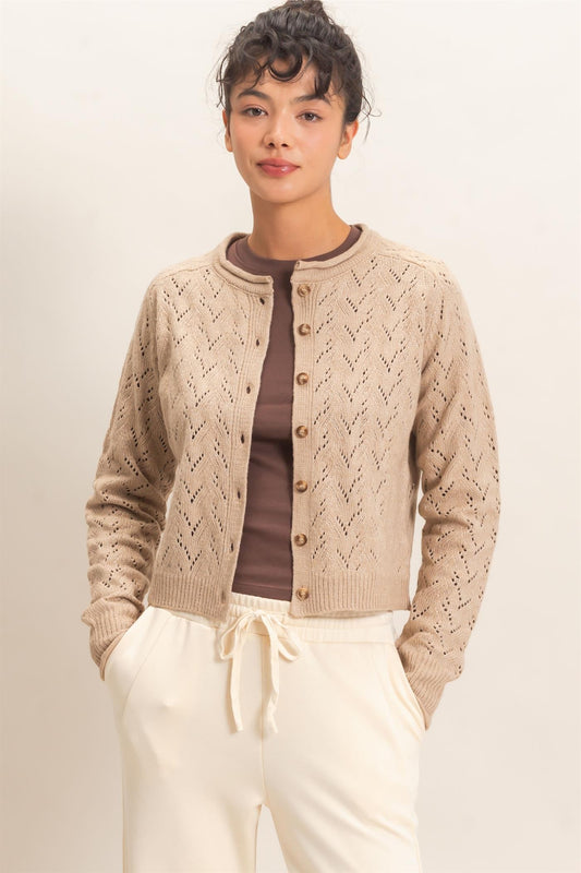 A timeless layering essential, this pointelle knit cardigan features a slightly cropped silhouette, button-front styling, and delicate details for effortless everyday charm.