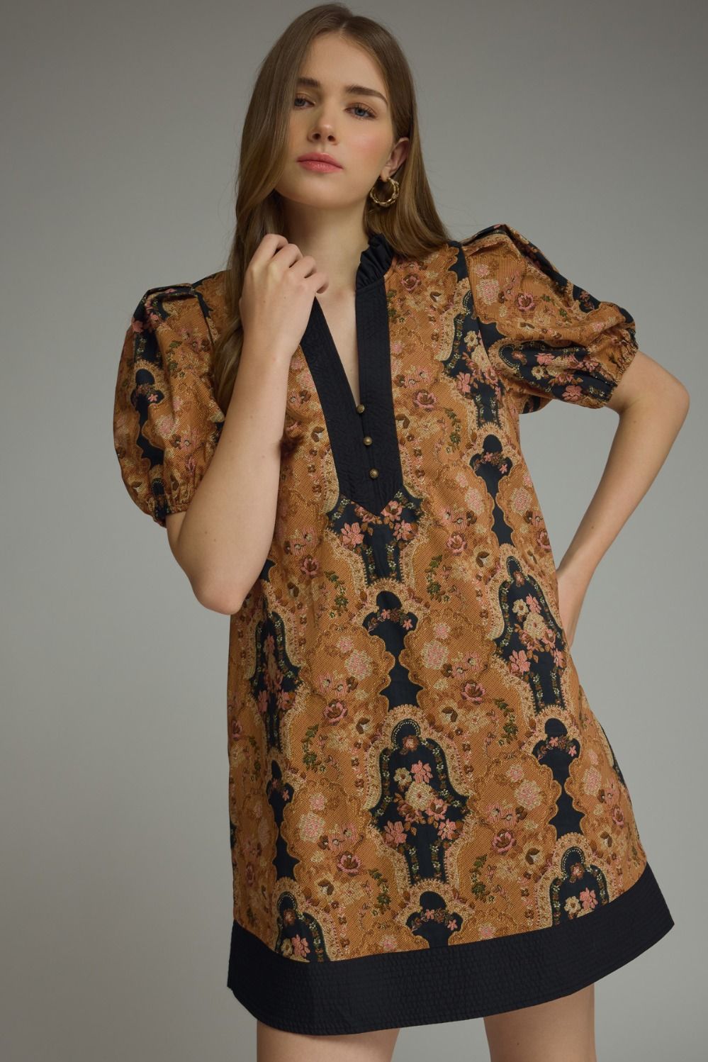  feminine printed mini dress featuring romantic puff sleeves, a contrast ruffle neckline, and lightweight comfort for effortless everyday elegance.