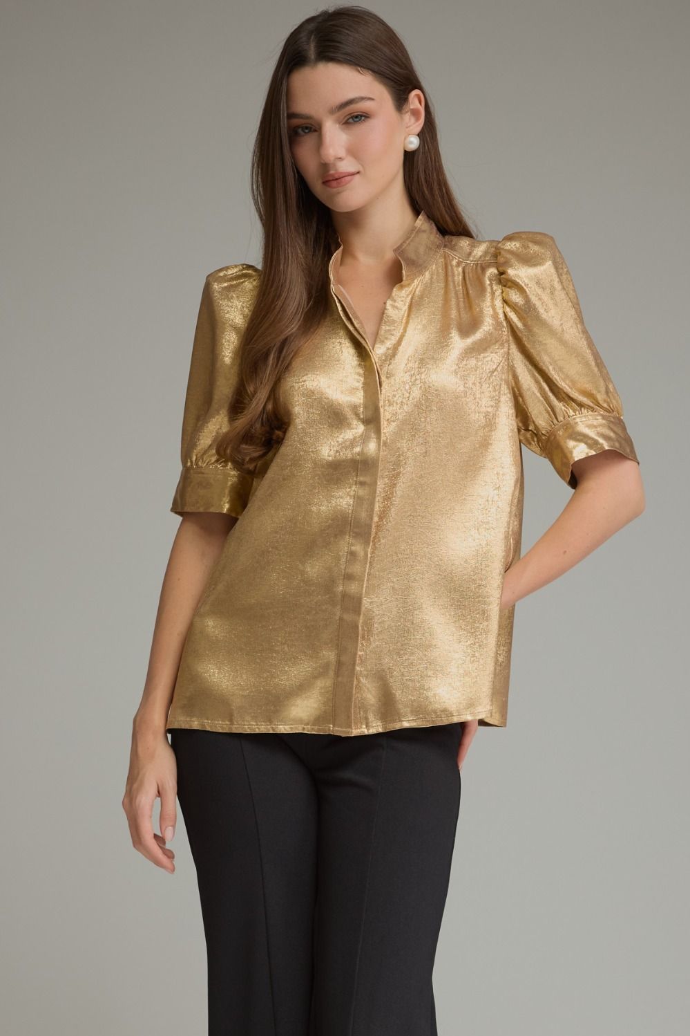 A polished metallic-finish top featuring short puff sleeves, a sophisticated high neckline, hidden front buttons, and button cuffs for an elevated statement look.