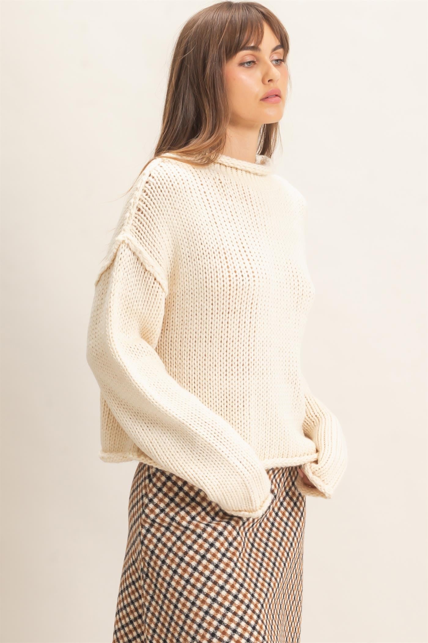 A relaxed loose-knit sweater with a casual rolled collar and dropped shoulders for effortless comfort and everyday style.