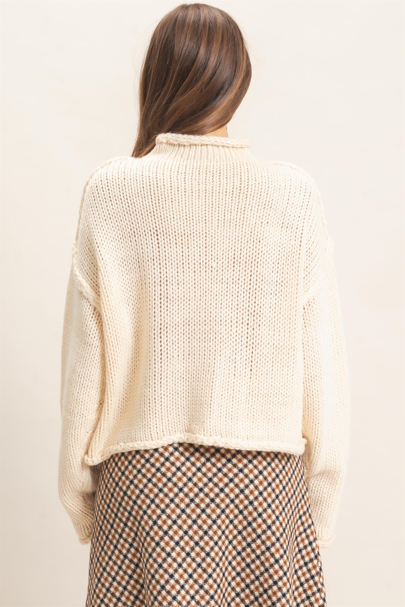 A relaxed loose-knit sweater with a casual rolled collar and dropped shoulders for effortless comfort and everyday style.