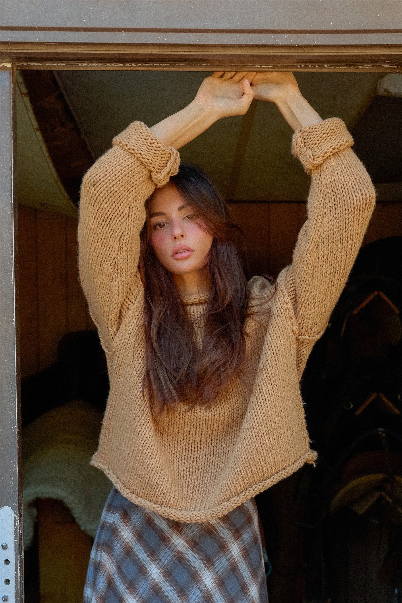 A relaxed loose-knit sweater with a casual rolled collar and dropped shoulders for effortless comfort and everyday style.