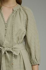 A timeless gingham mini dress featuring ¾ sleeves, a self-tie waist belt, and a button-front design for effortlessly polished style.
