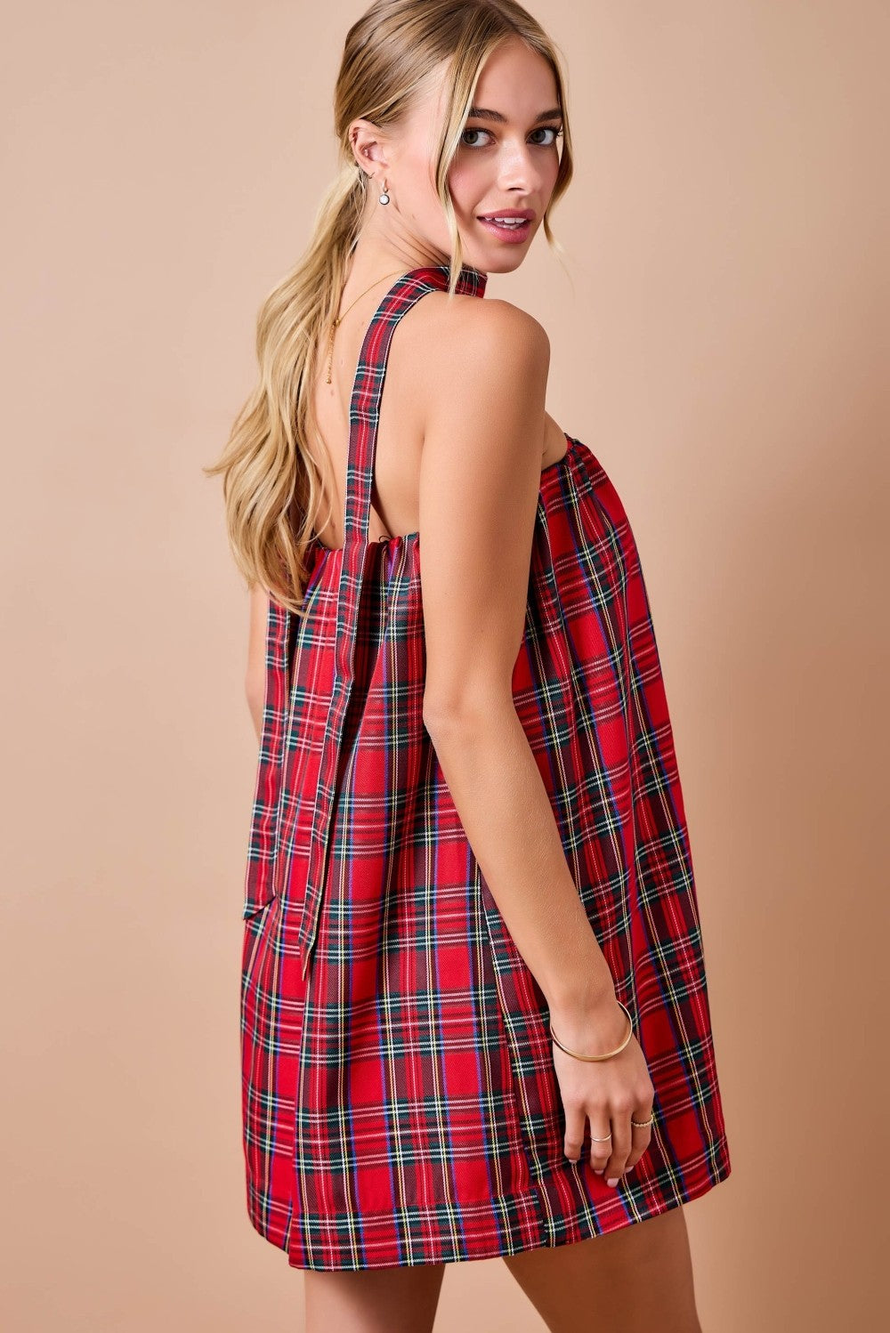 Celebrate the season in style with this festive holiday plaid strapless mini dress, complete with a matching scarf for a coordinated holiday look.